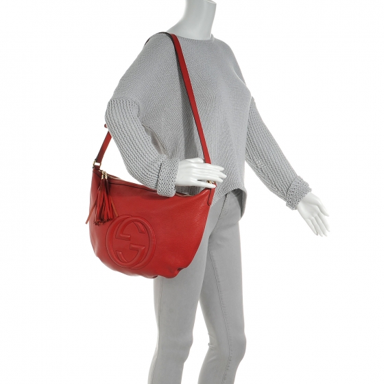 red gucci man bag