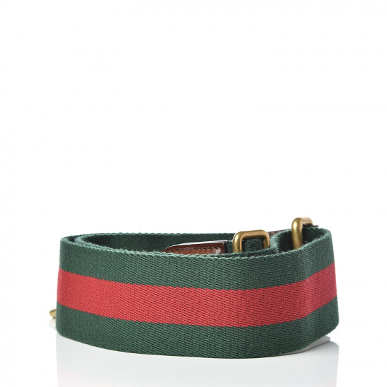 black gucci handbag with red and green strap