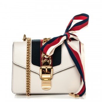 white gucci purse with gold chain